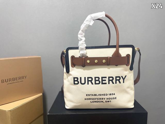 牛皮 Burberry The Belt 铆钉帆布 贝尔特包换上帆布材质后看起来更轻松自在正面印有 Burberry England 手提包立马就有了感觉bur