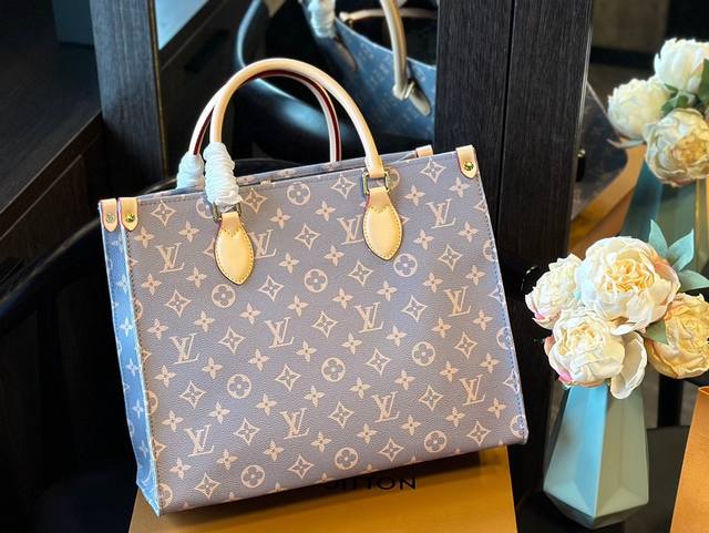 Lv 新款 全球限定 Onthego中号手袋释放monogram Empreinte压纹皮革的娴雅意味，可为当季造型注入盎然春意。充裕容量满足都市出行或商务所需